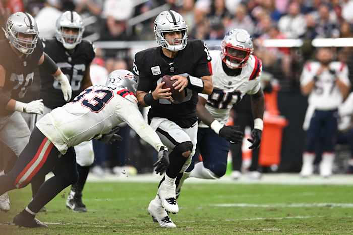 Oct 15, 2023; Paradise, Nevada, USA; Las Vegas Raiders quarterback Jimmy Garoppolo (10) is tackled by New England Patriots linebacker Anfernee Jennings (33) in the second quarter at Allegiant Stadium.